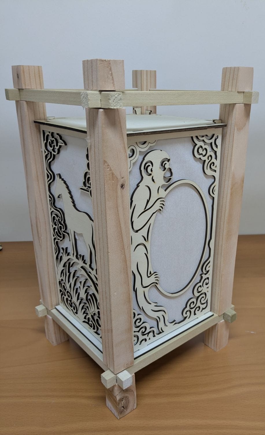The frame with monkey and horse panels set between the posts